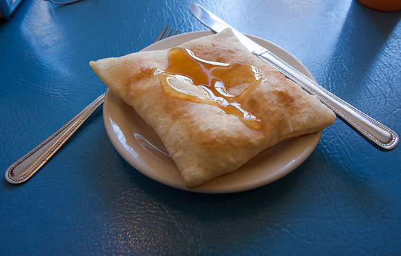 Dessert sopapilla topped with honey